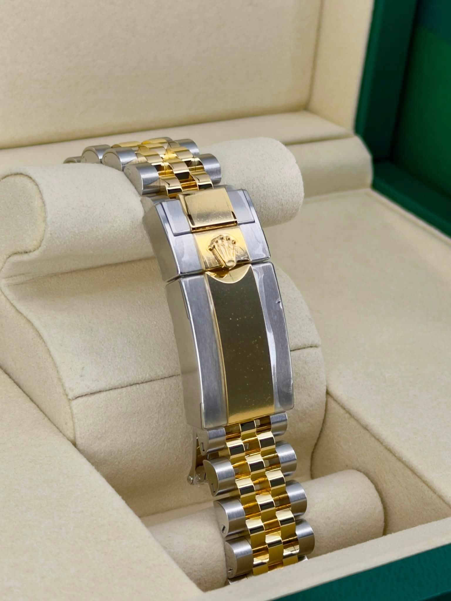 May be an image of jewelry and wrist watch