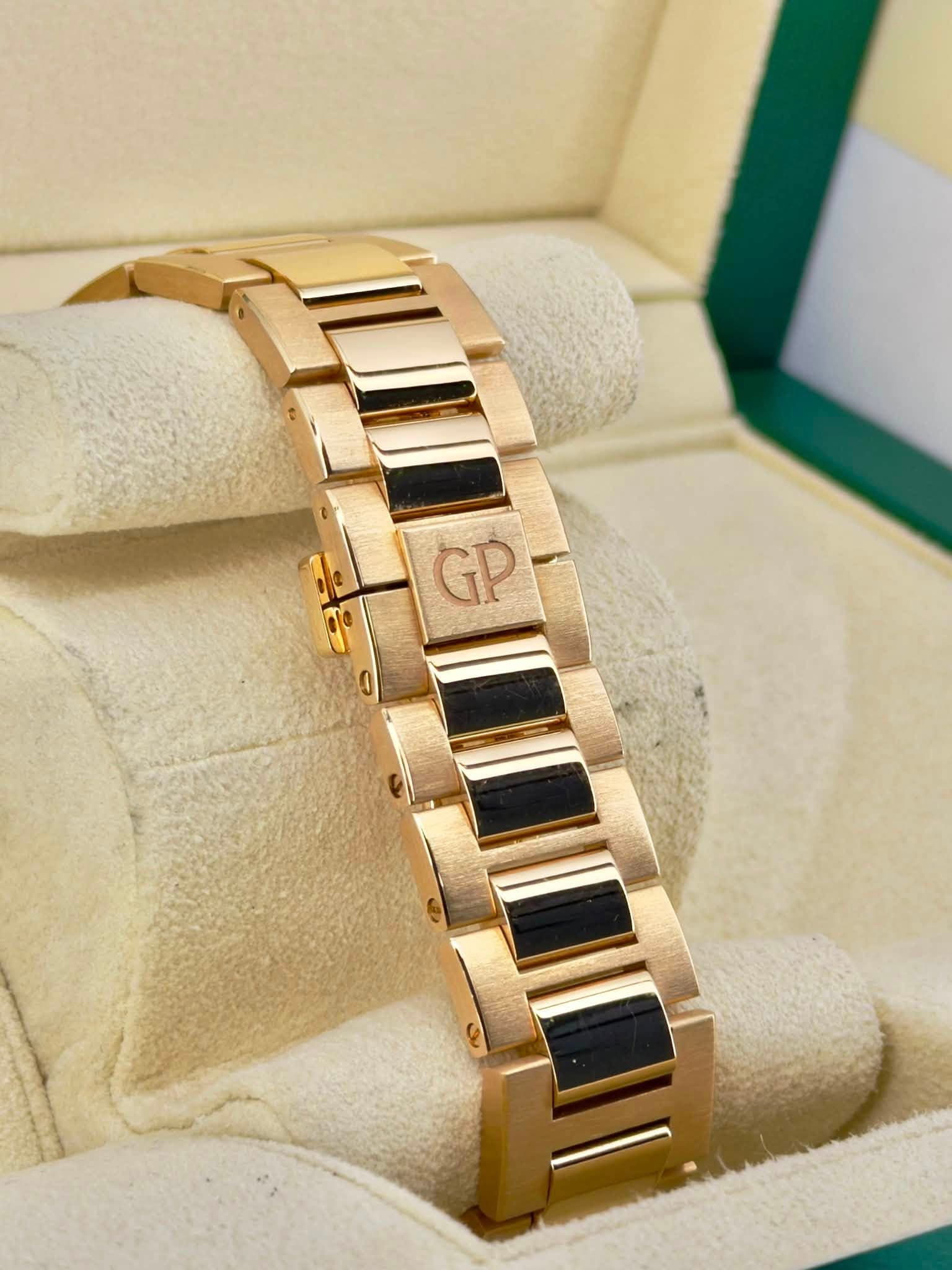 May be an image of wrist watch, jewelry and text that says 'GP'