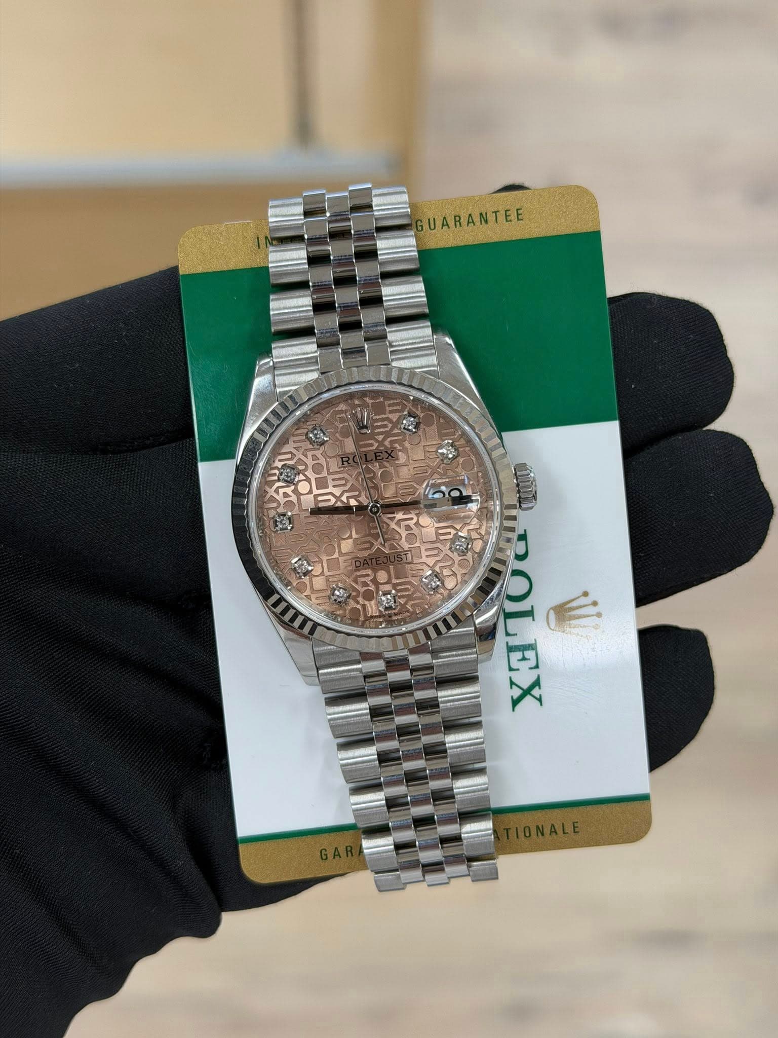 May be an image of wrist watch and text that says 'GUARANTEE ROLEX LEX'
