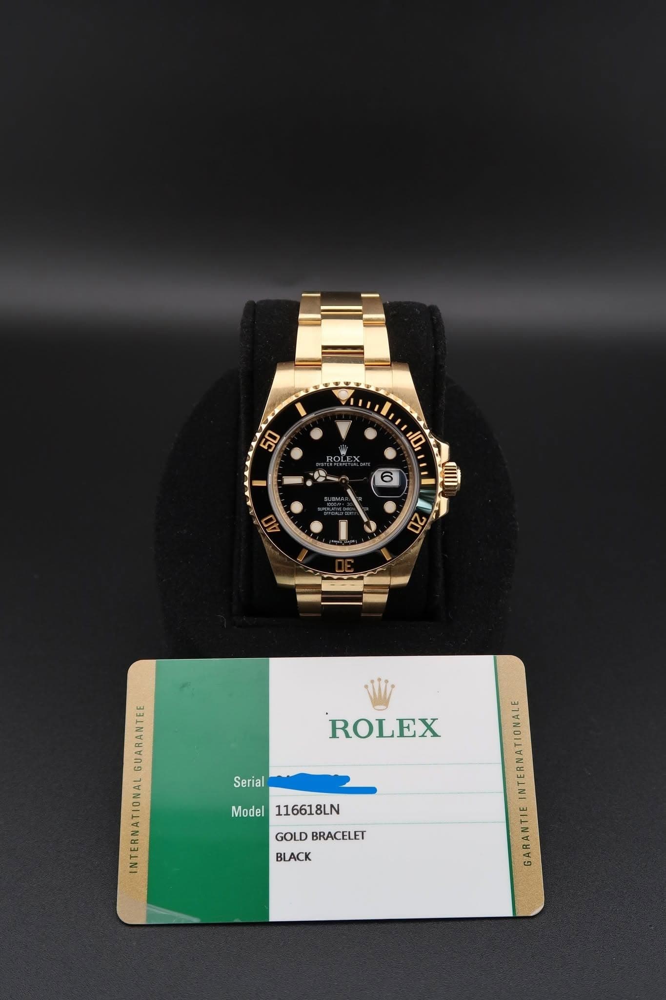 May be an image of wrist watch and text that says '50 ROLEX 人 هر 10 III 6 40 S 20 ROLEX ΦυΛΝTE GUARANTEE INTERNATIONAL Serial Model116618LN Model 116618LN GOLDBRACELET GOLD…
