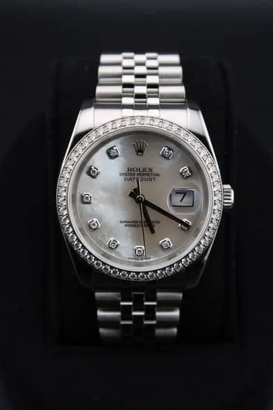May be an image of wrist watch and text