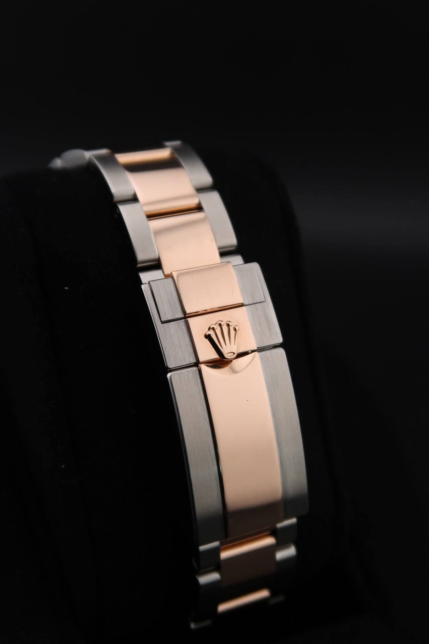 May be an image of jewelry, wrist watch and text