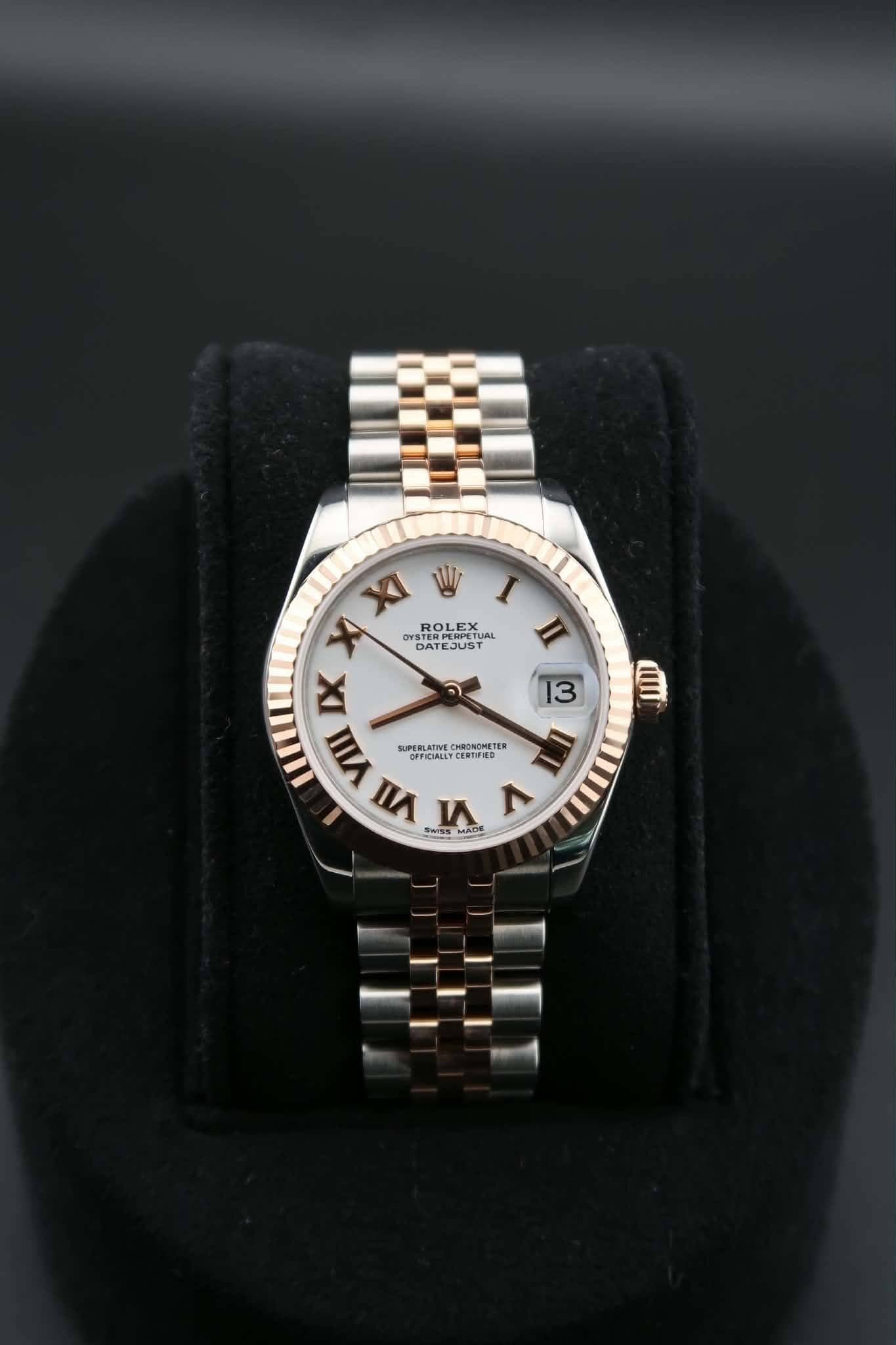 May be an image of wrist watch, jewelry and text