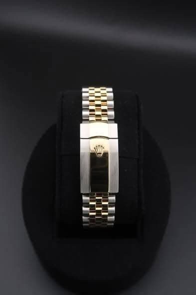 May be an image of jewelry and wrist watch