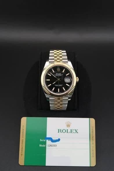 May be an image of wrist watch and text that says 'OLEX 14 erTa ROLEX Serial Serial 4AB Modal126333 Model 126333 AD'