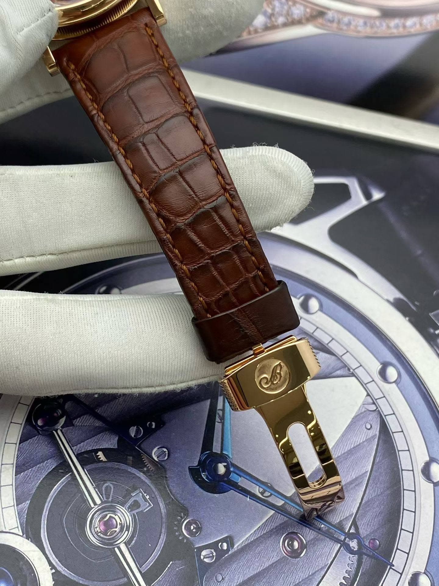 May be an image of wrist watch and text