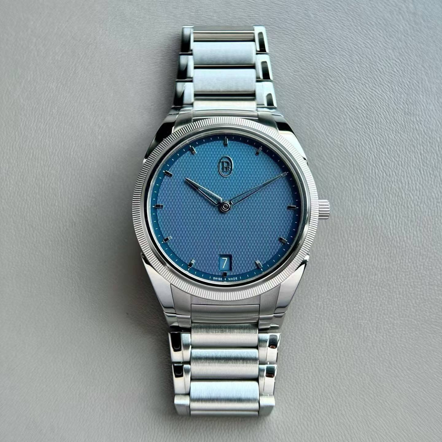 May be an image of wrist watch and text