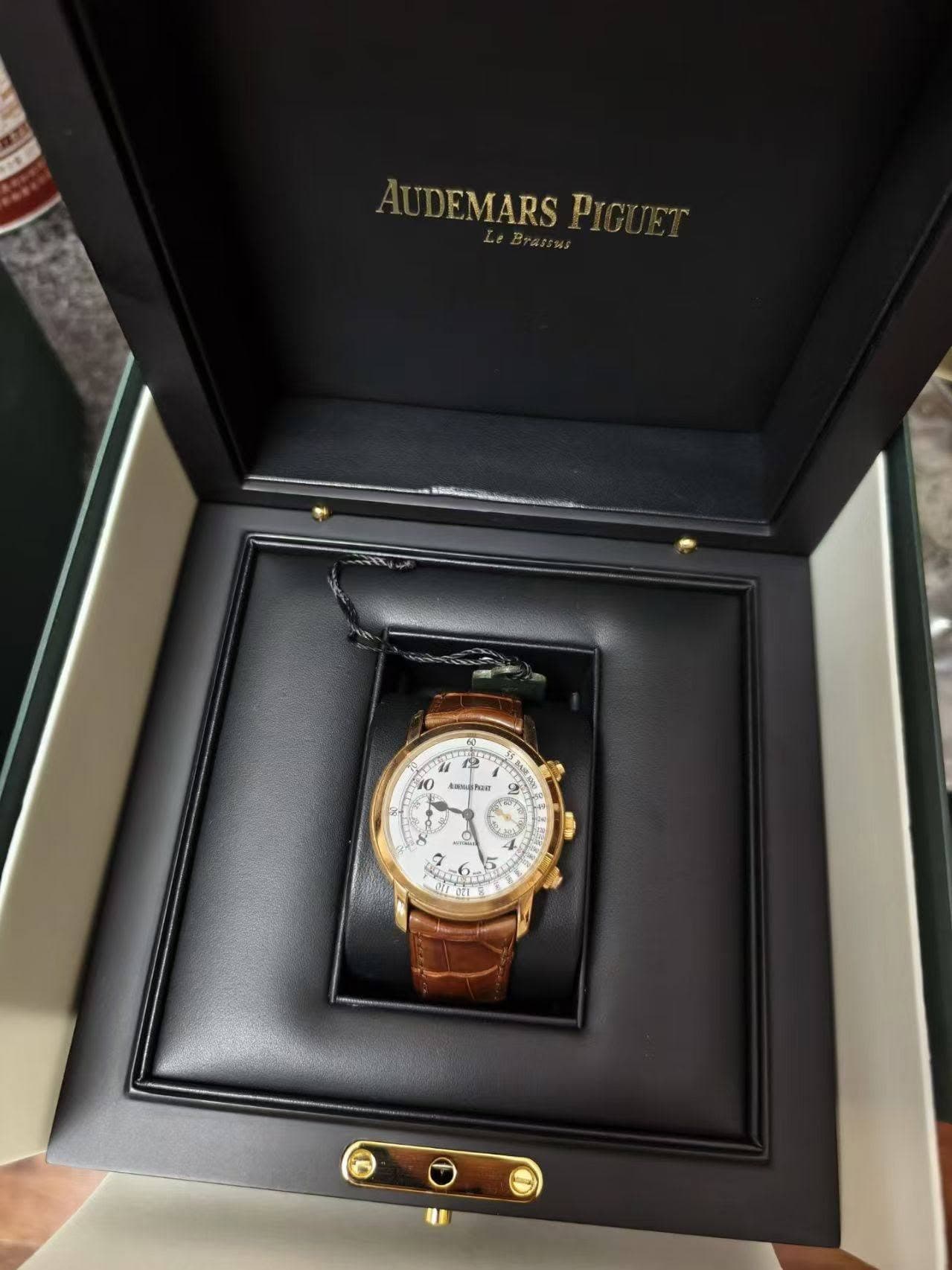 May be an image of wrist watch and text