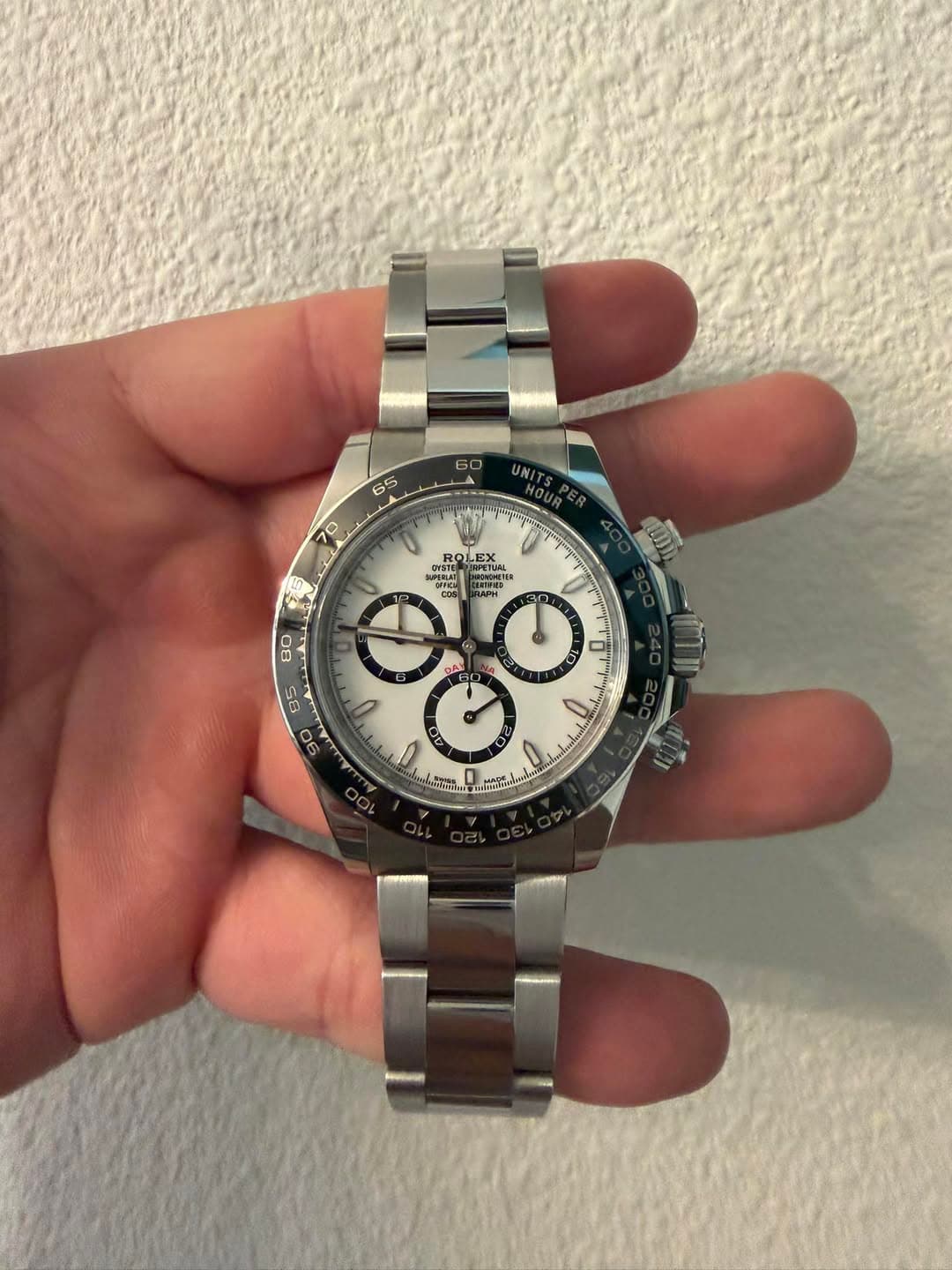 May be an image of wrist watch and text