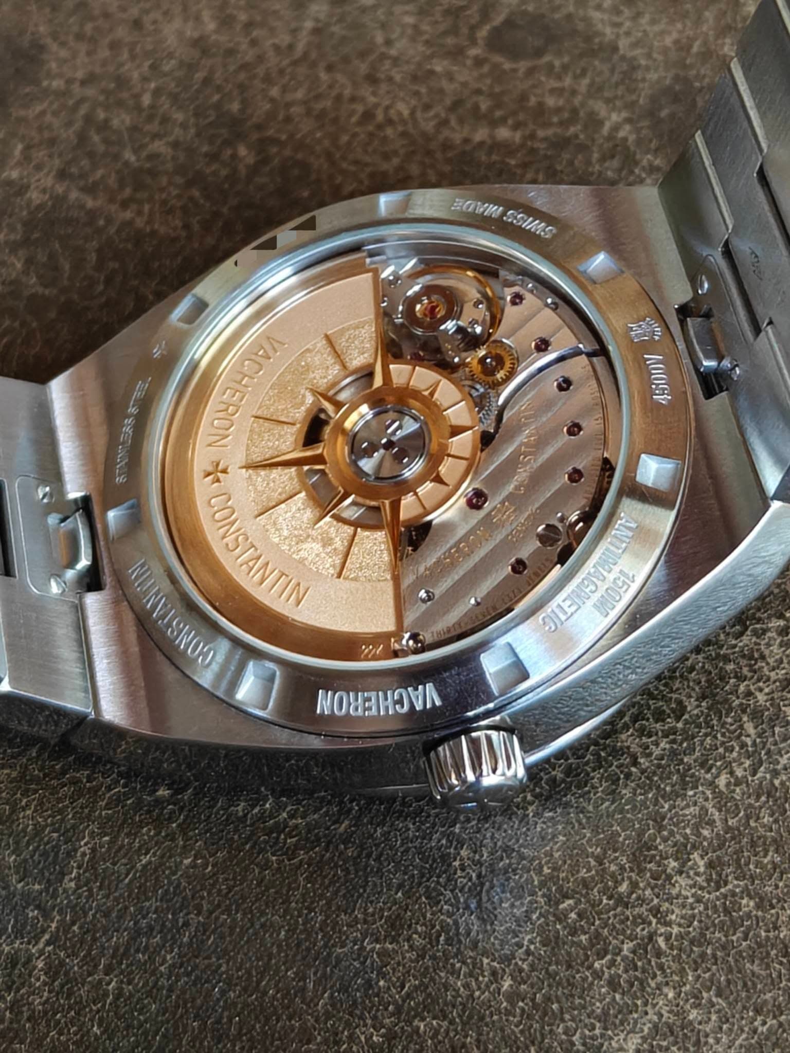 May be an image of wrist watch and text