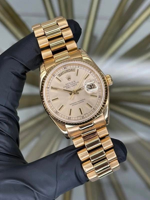 May be an image of wrist watch and text