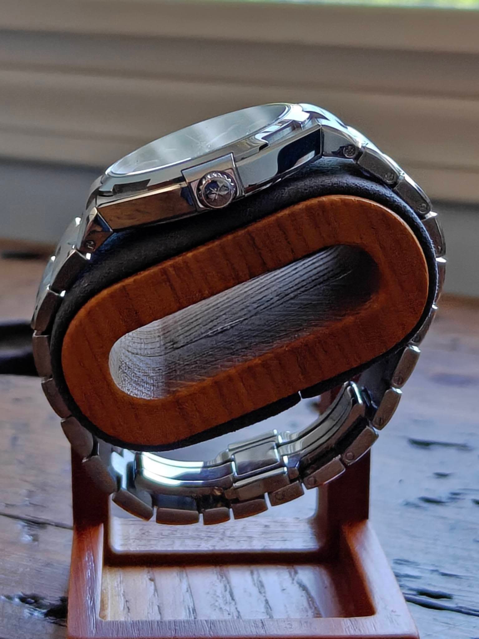 May be an image of wrist watch and text