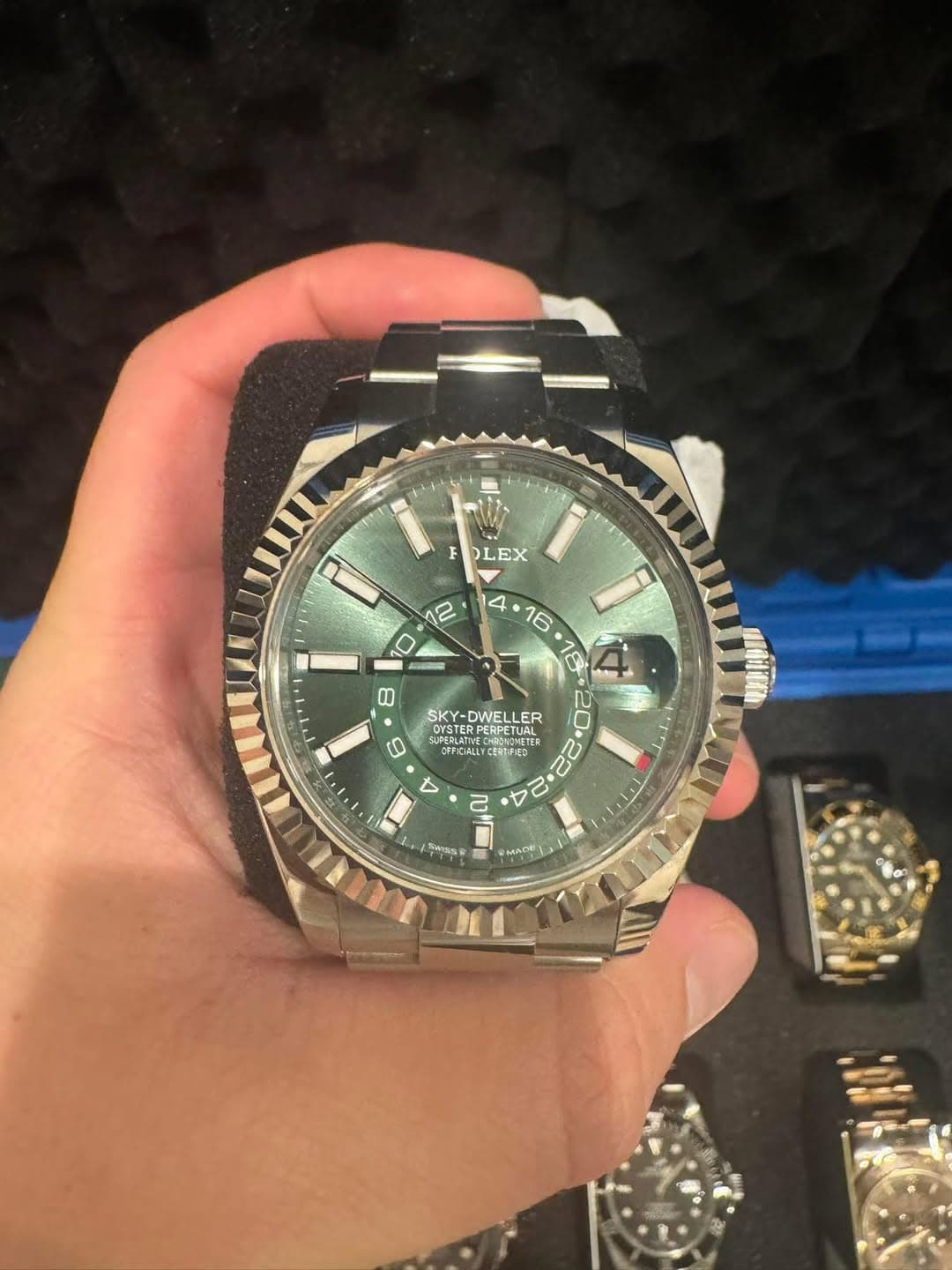May be an image of wrist watch and text