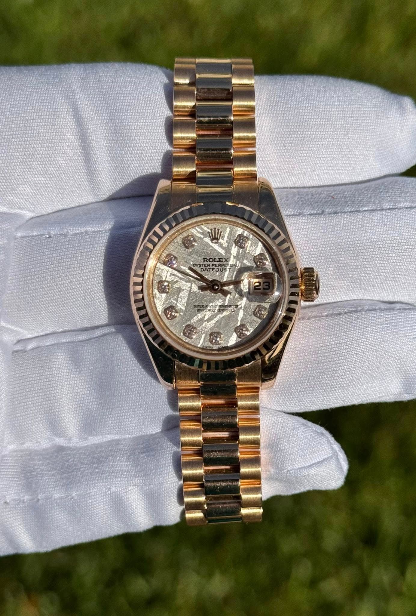 May be an image of wrist watch and text