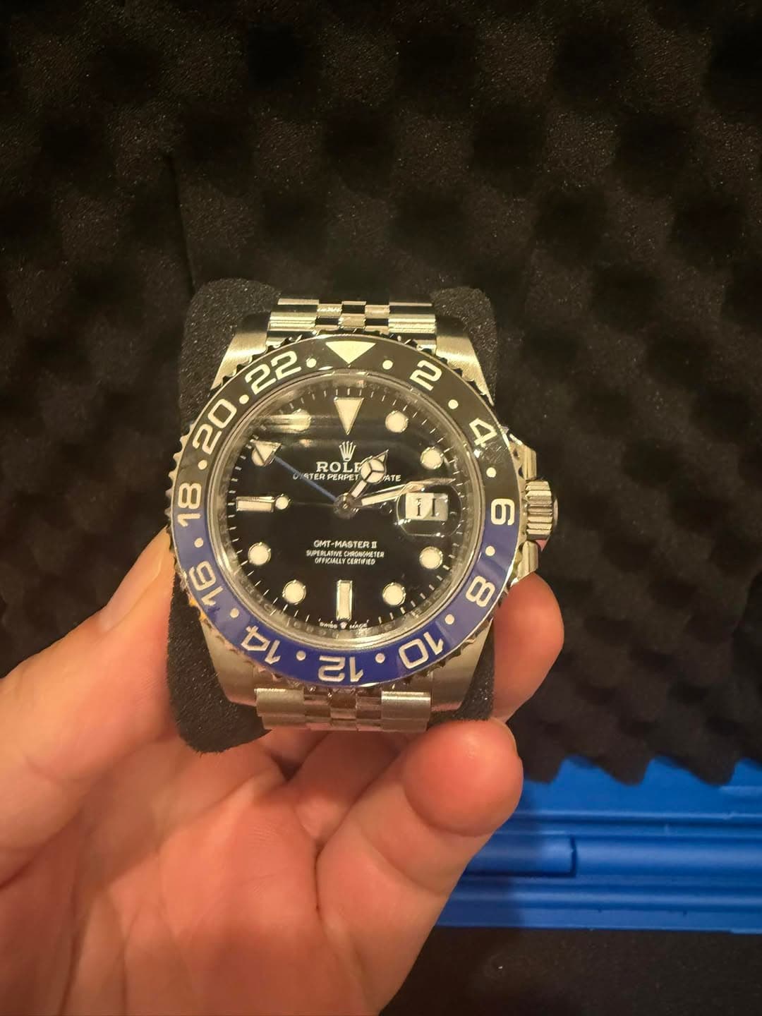 May be an image of wrist watch and text