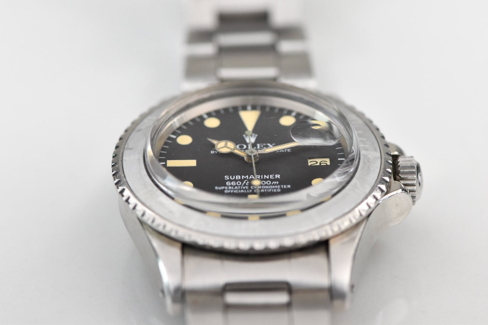 May be an image of wrist watch and text