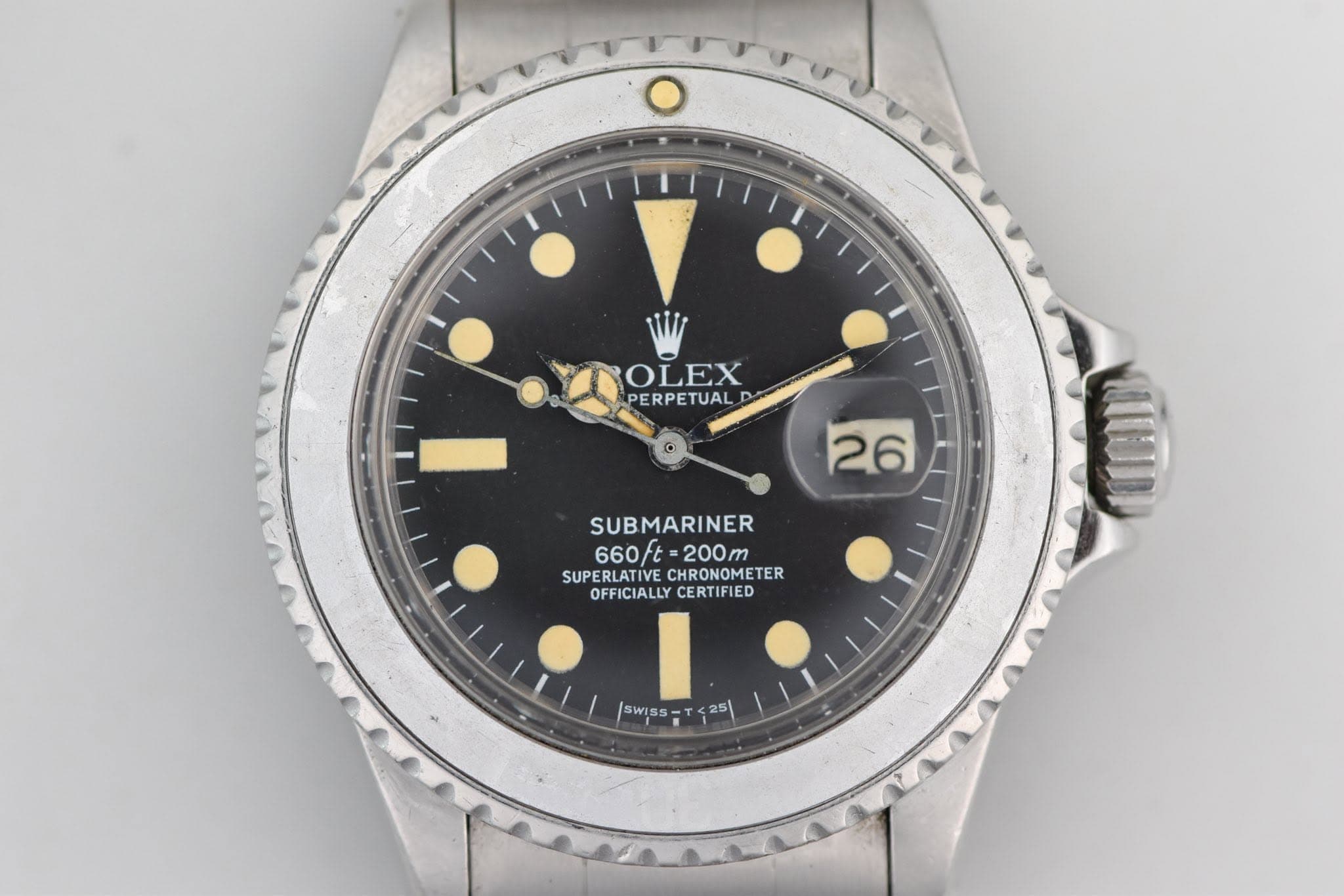 May be an image of wrist watch and text that says 'o OLEX PERPETUAL 26 SUBMARINER 660ft ヒー 200m 660ft-200m T SUPERLATIVE CHRONOMETER SUPERLATIVECHRONOMETER TER OFFICIALLY…