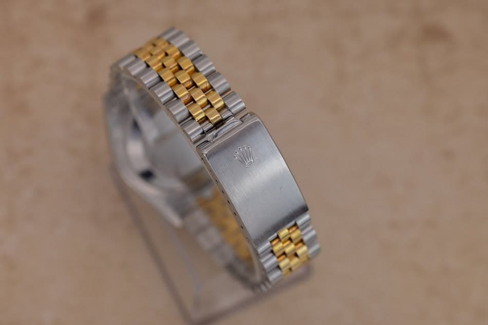 May be an image of wrist watch and jewelry