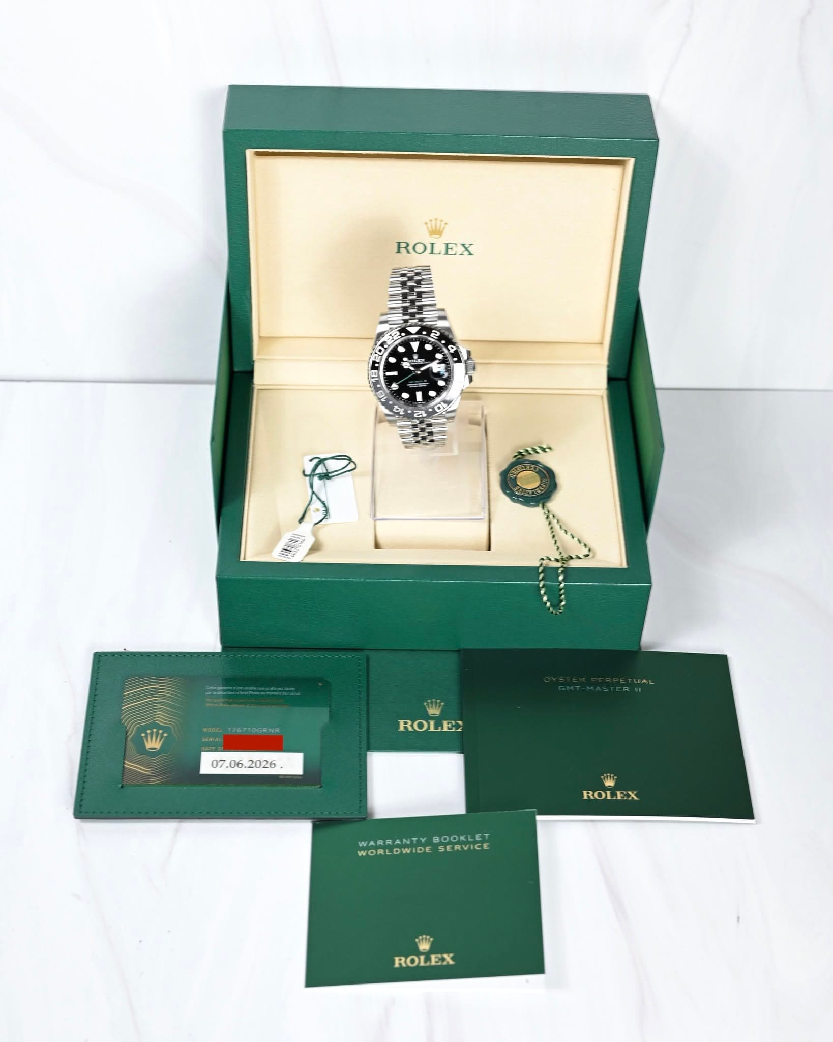 May be an image of cufflinks, napkin ring, wrist watch and text