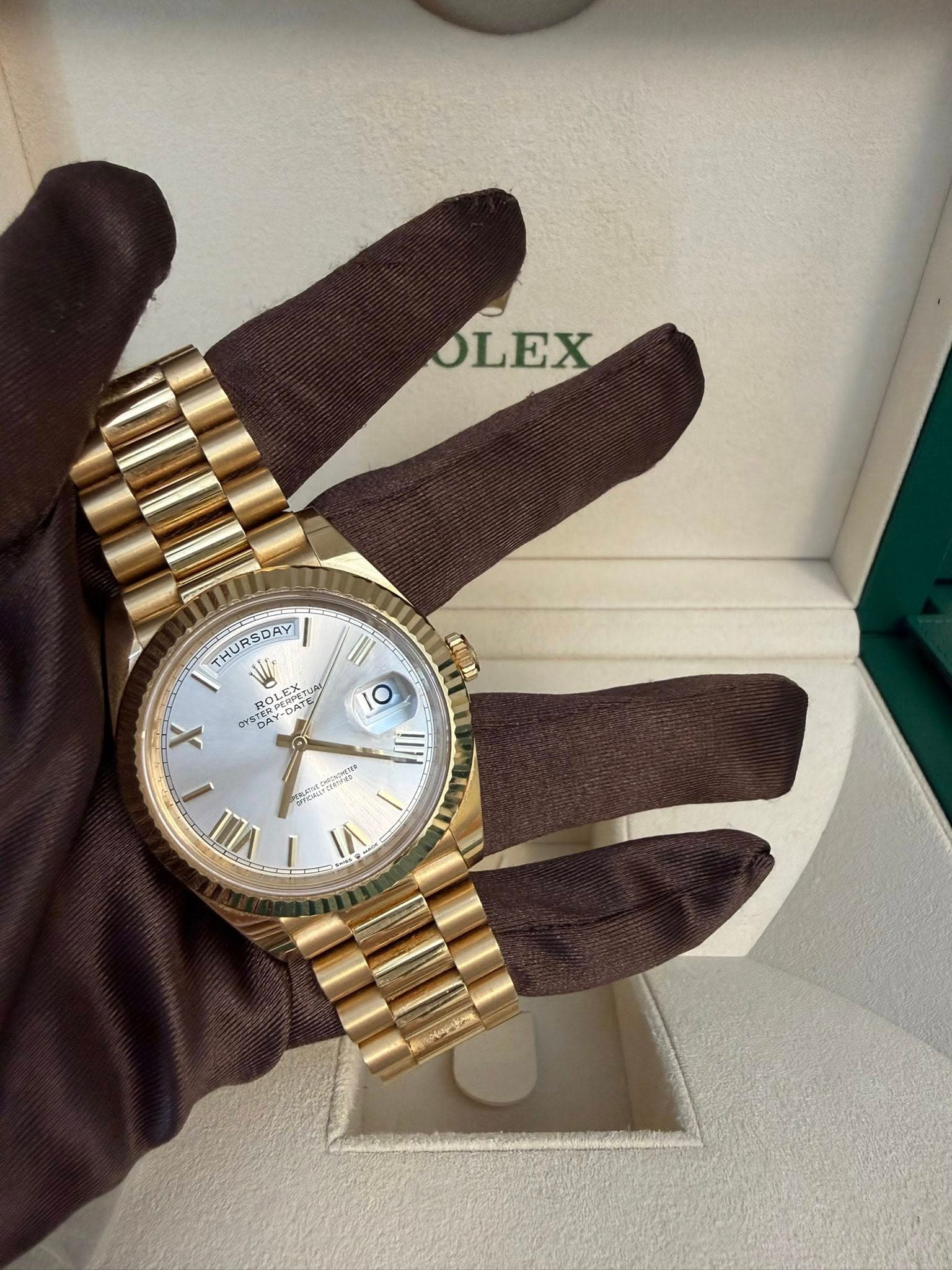 May be an image of wrist watch and text