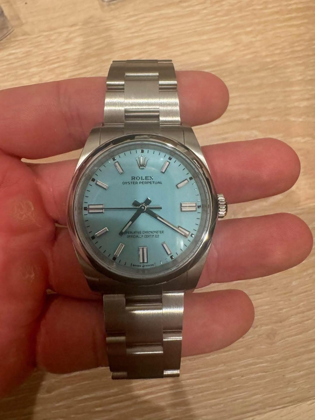 May be an image of wrist watch and text