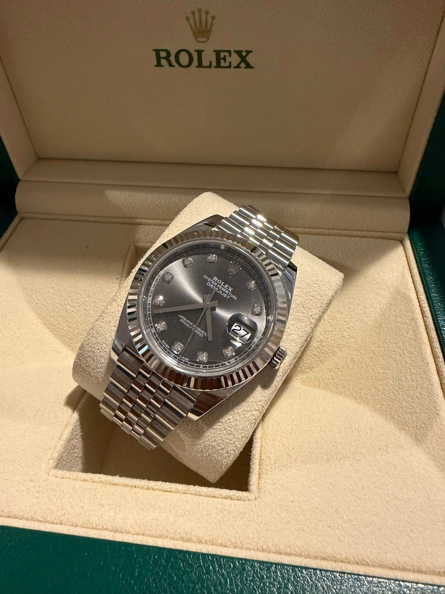 May be an image of wrist watch and text