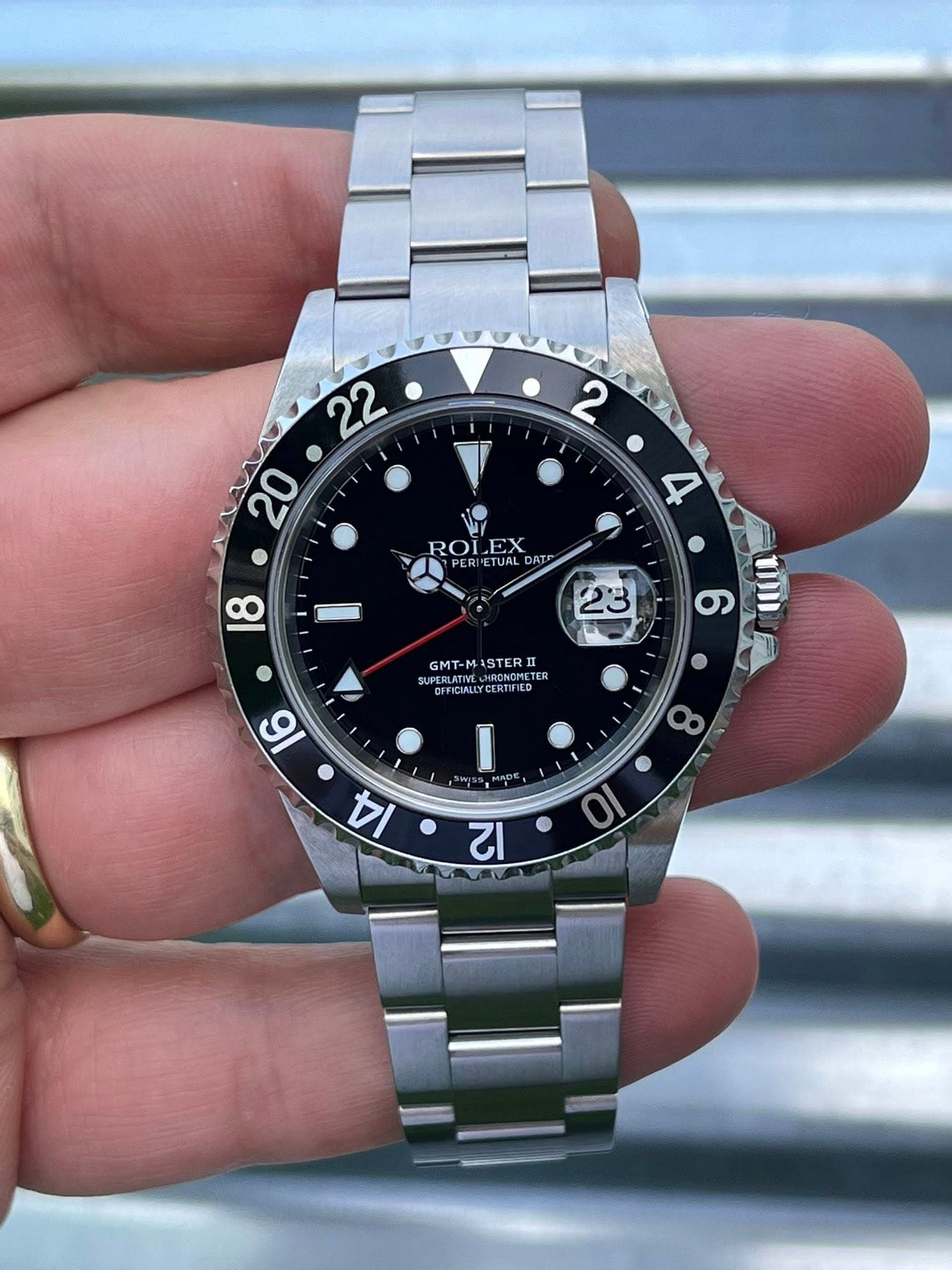 May be an image of wrist watch and text