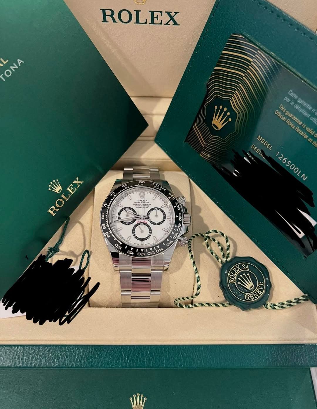 May be an image of wrist watch and text that says 'ROLEX ONA ONA por Cette Officia Thisquarantee uaran detaiilant dobsillant arartie Retailer valid SERIha MODEL atth 26500LN W…