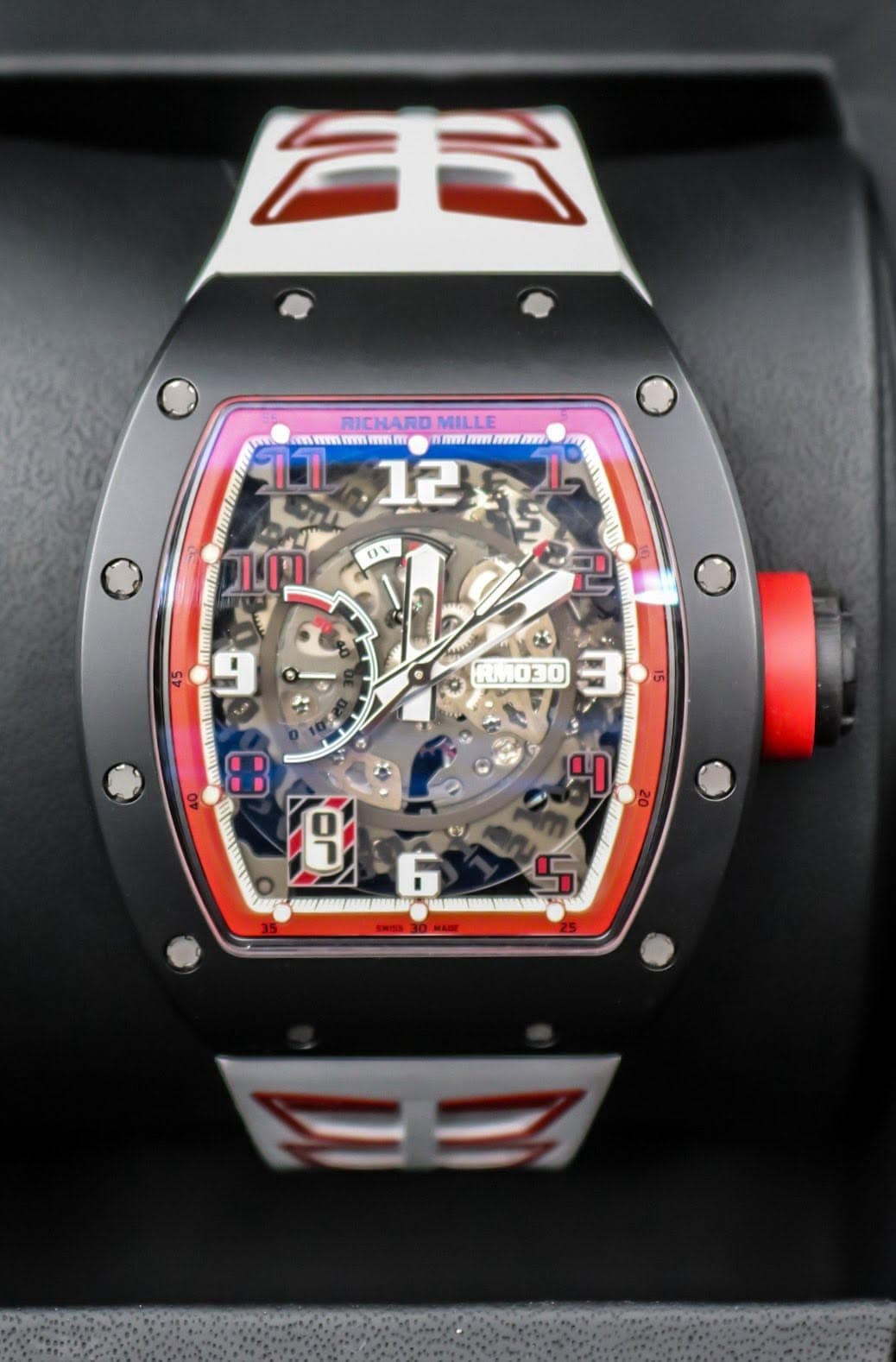 May be an image of wrist watch and text that says 'ف RICHARD RICHARDMILLE MILLE EN NWn T Wn nay mm mm. I 125 12 1- M UT ניויו R030 I 4 9 F 6'