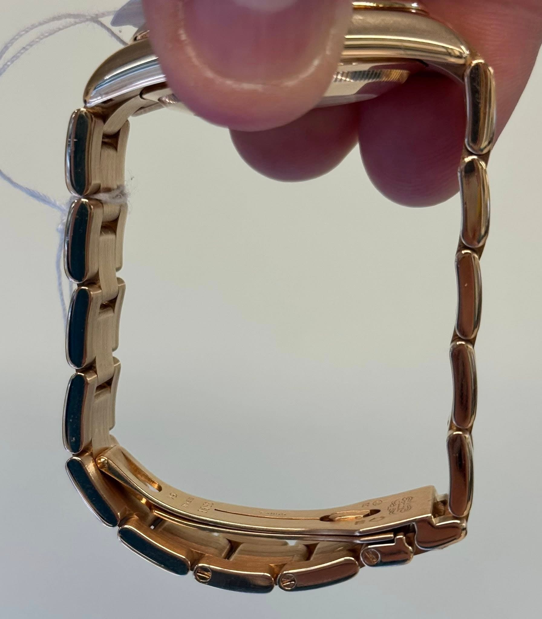 May be an image of wrist watch and jewelry