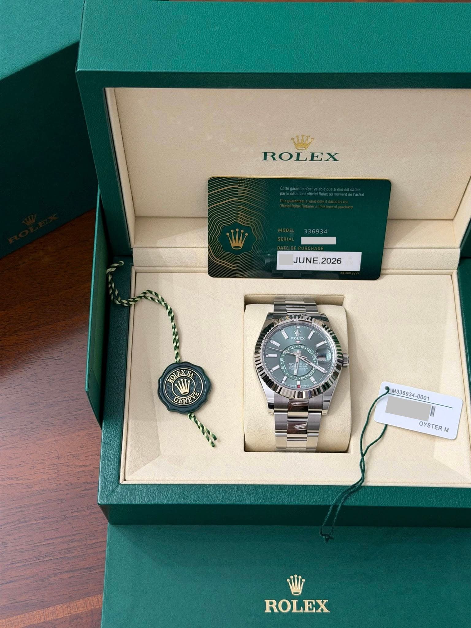 May be an image of wrist watch and text that says '山 ROLEX JUNE. JUNE. 1 CS BOLEXSA WW GEN CENEN タ M336934-0001 M33693 OYSTER ROLEX'
