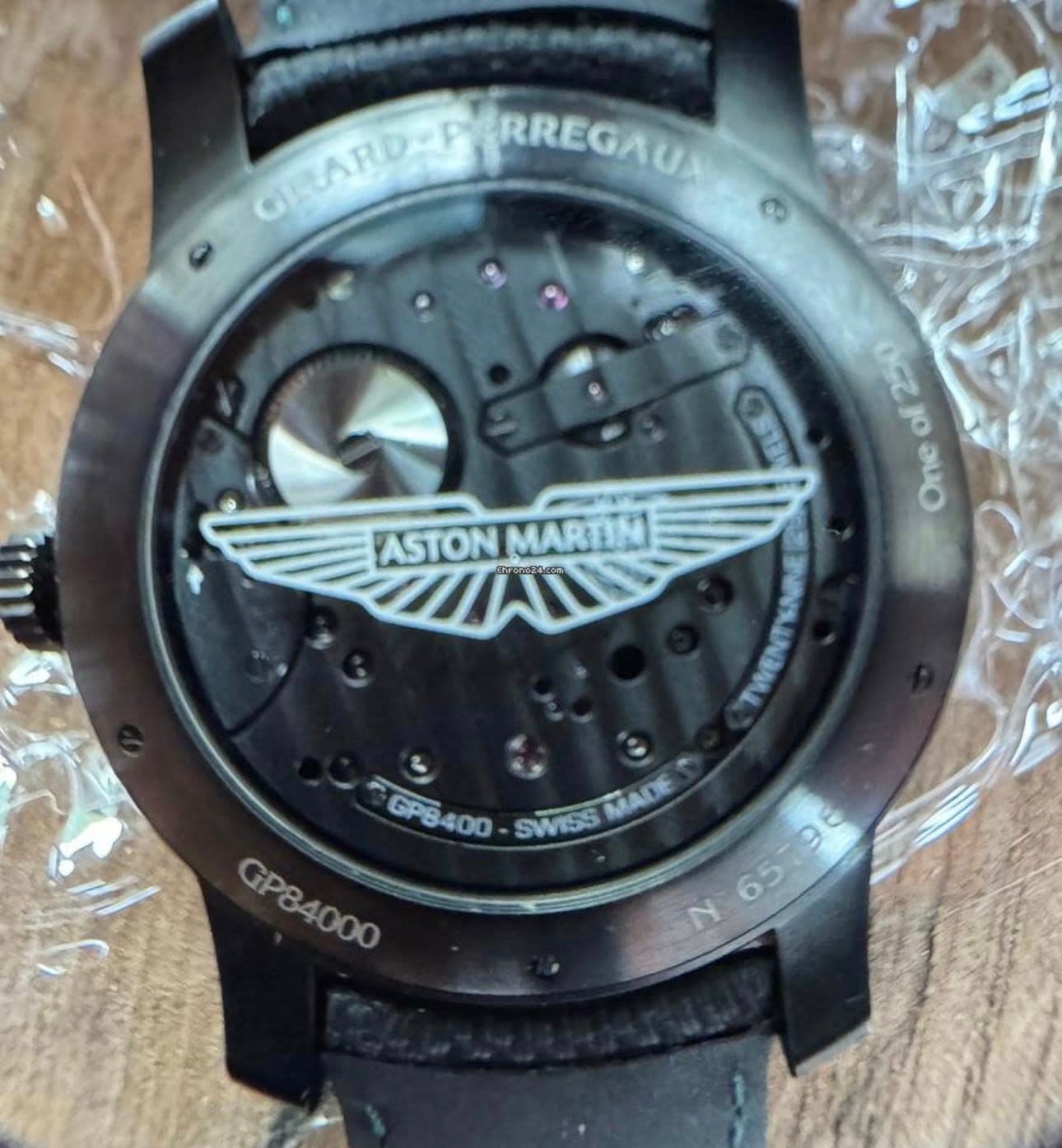 May be an image of wrist watch and text that says 'CHARDAP GIRLARD- CLARUARRREGAUA PERREGAU 0ceJO 2၀ နှ၀ One ASTONMARTINI IIAN ASTON MARTIN WWENT GP6400 GPB GPB400 SWISS MADE…