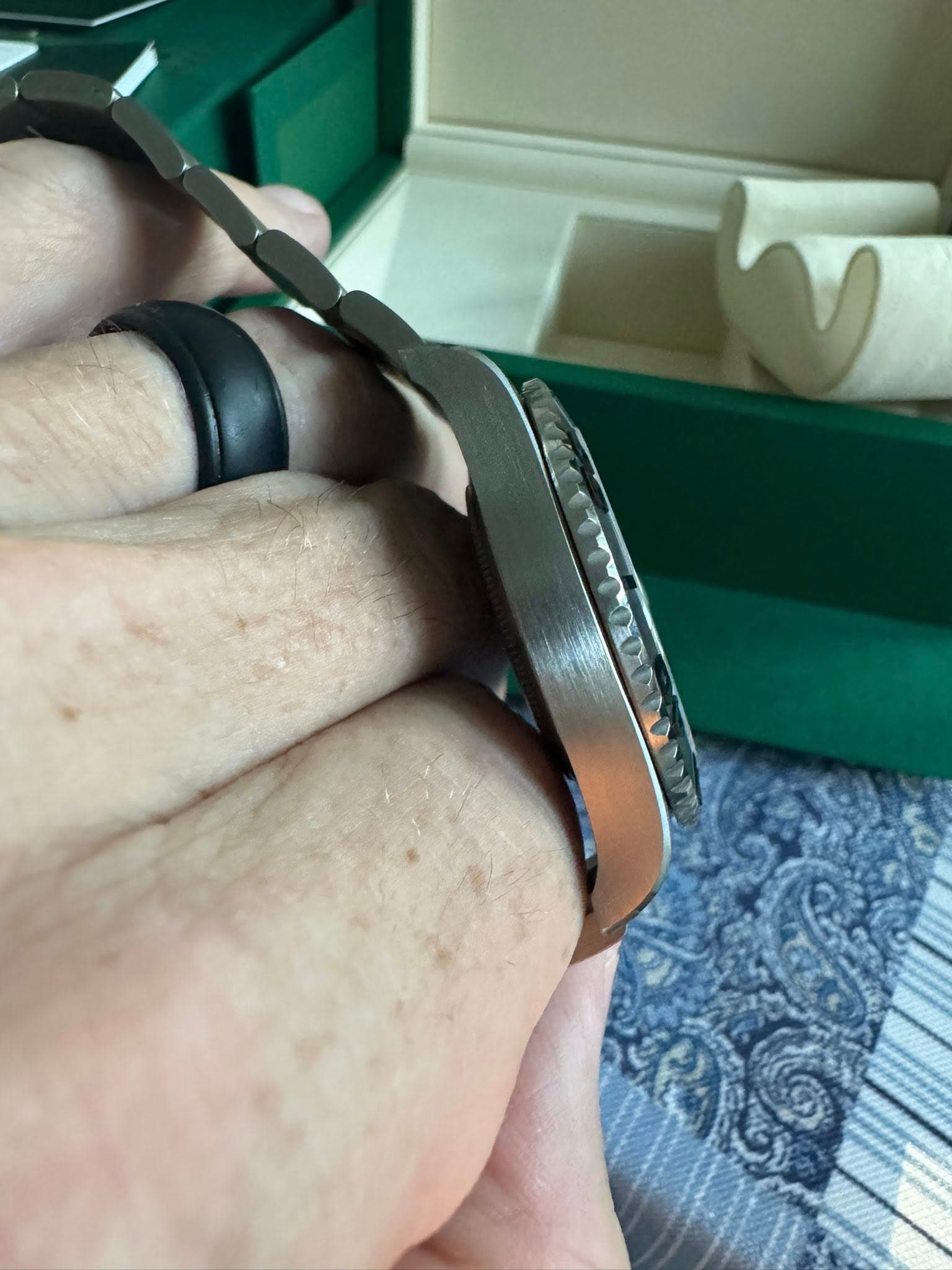 May be an image of wrist watch and ring