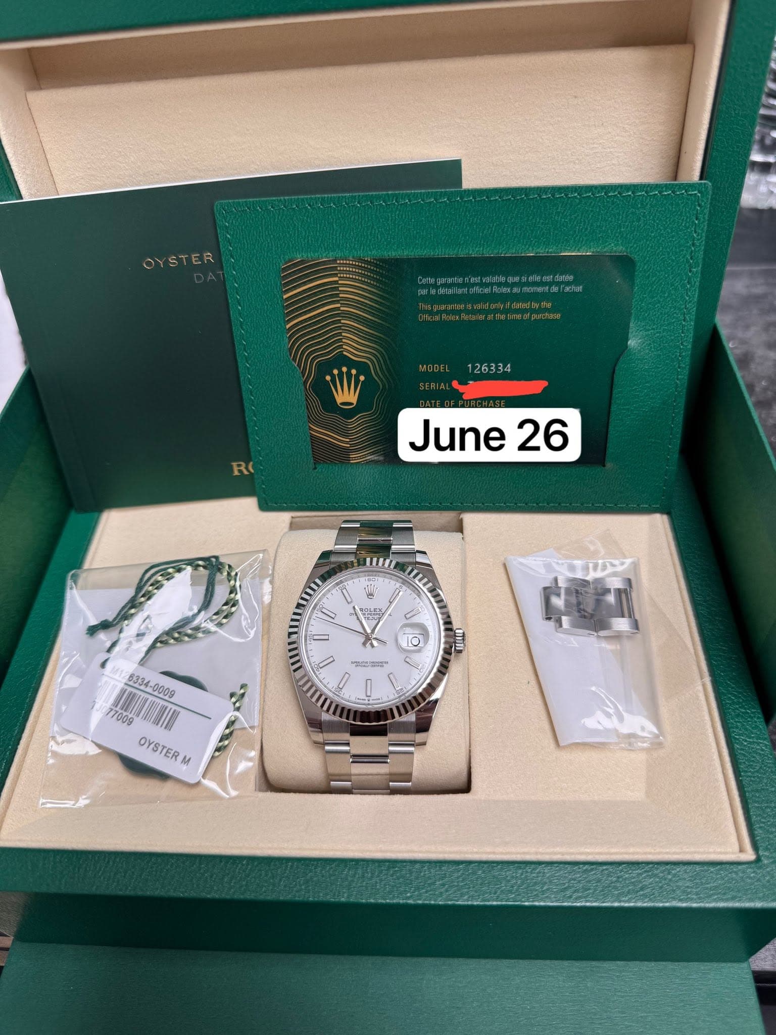 May be an image of wrist watch and text that says 'OYSTER 126334 June June26 26 W 0 편있스면 ን 0 10 UIIT OYSTERM M 다미'