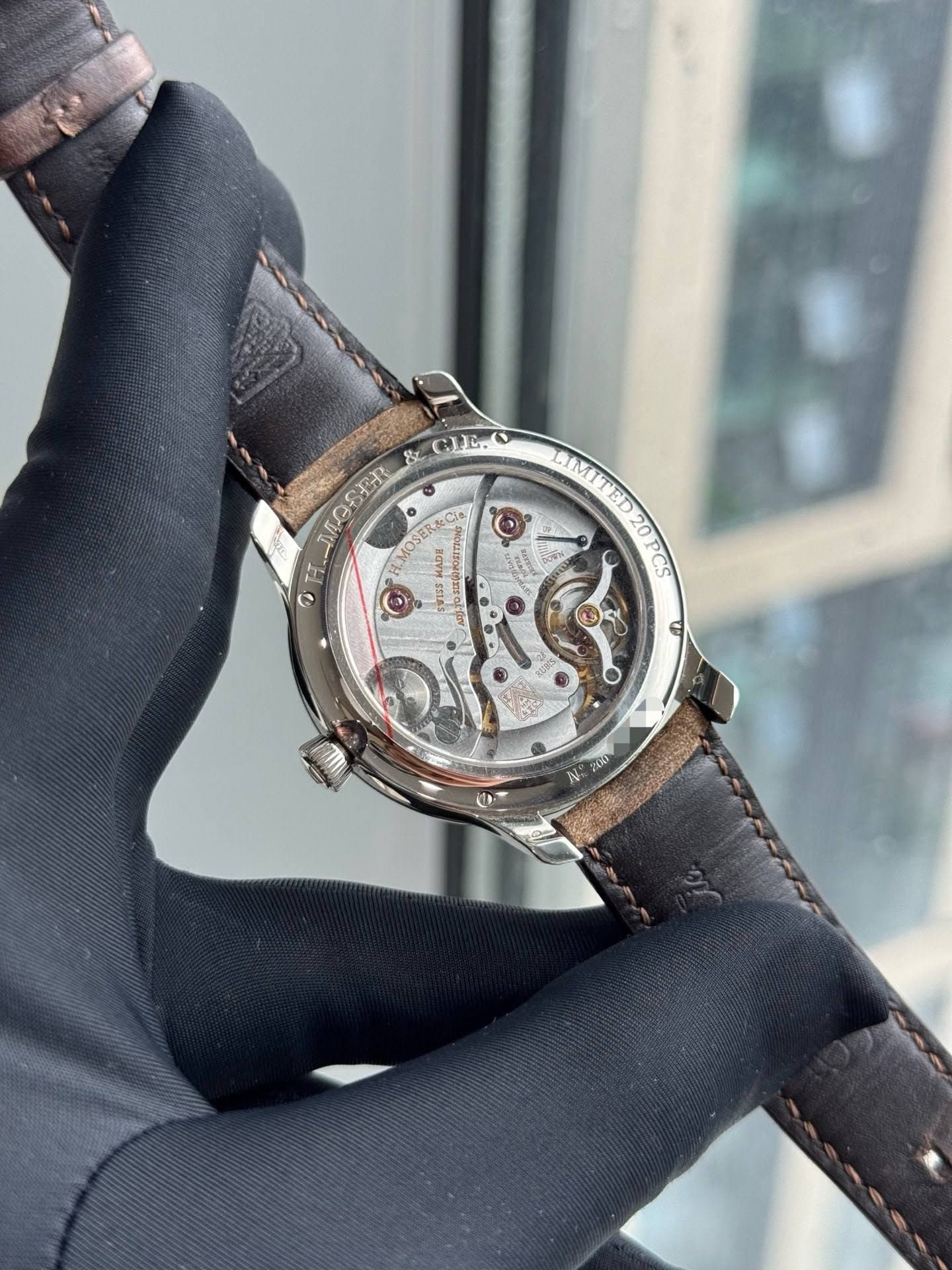 May be an image of wrist watch and text