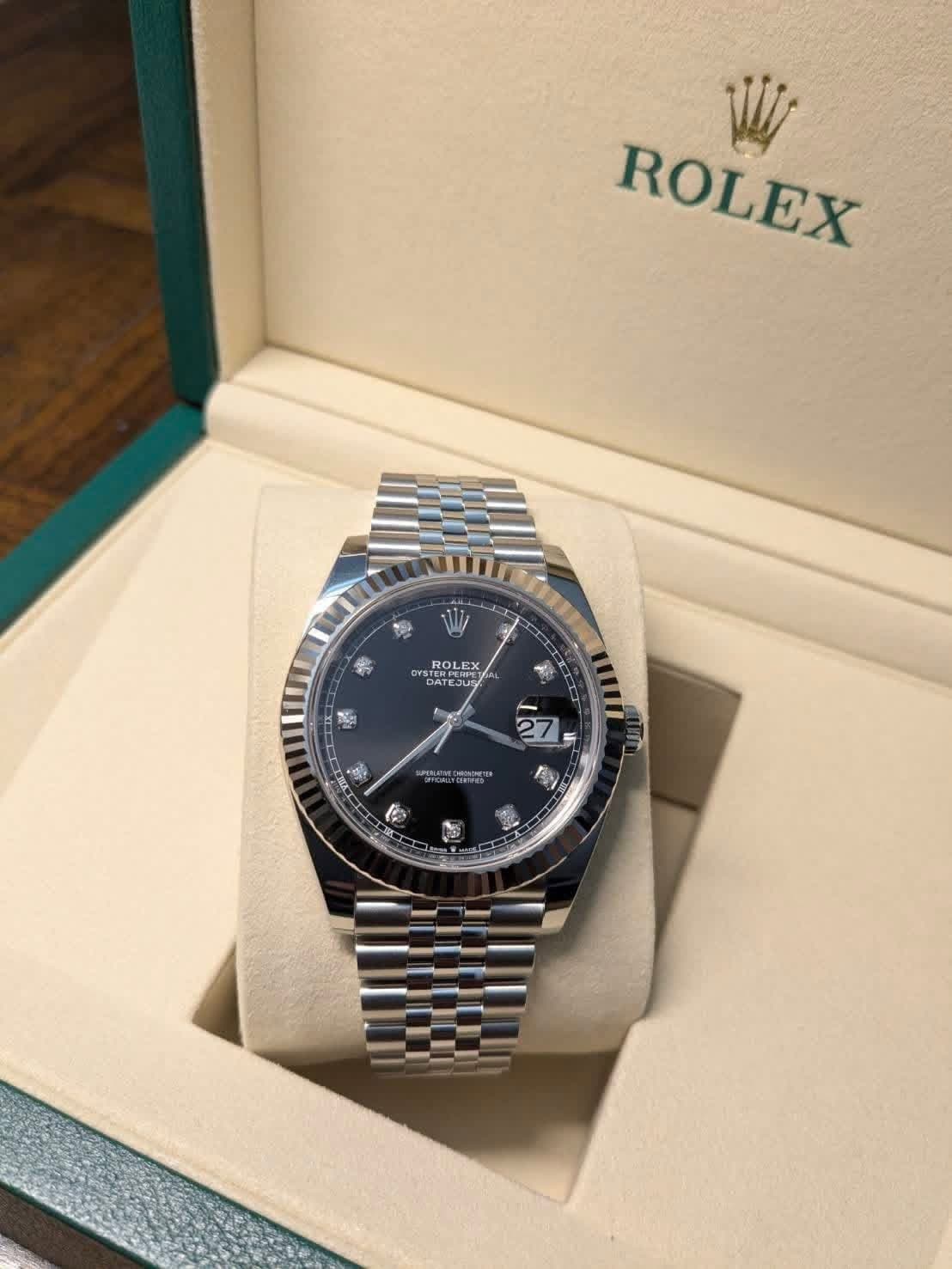 May be an image of wrist watch and text