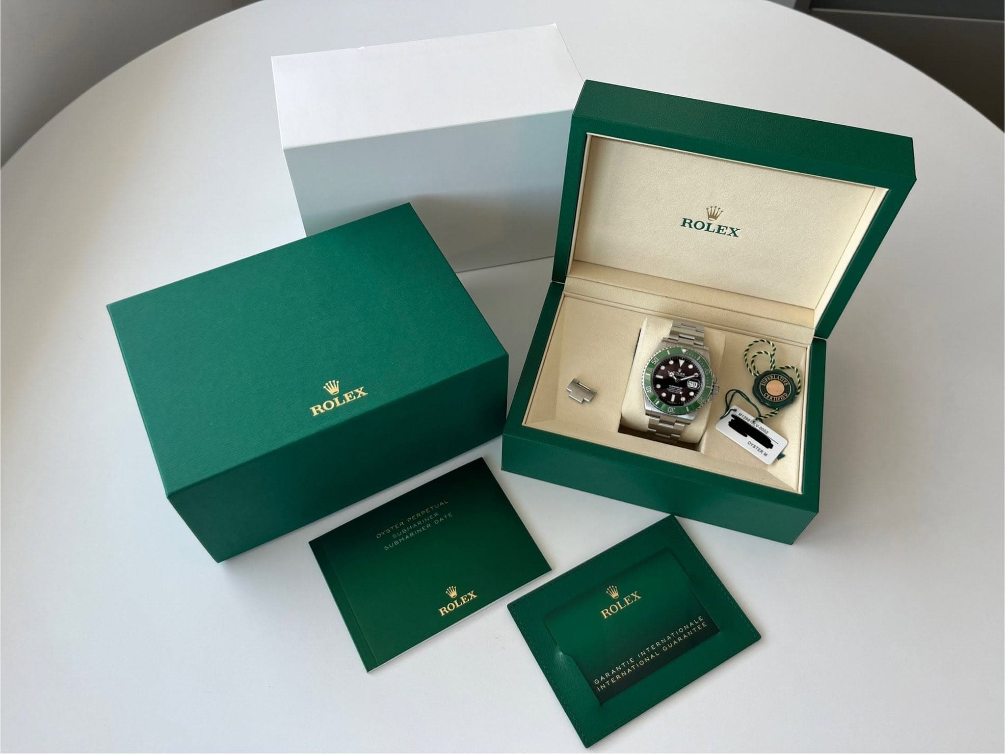 May be an image of jewelry, cufflinks, wrist watch and text