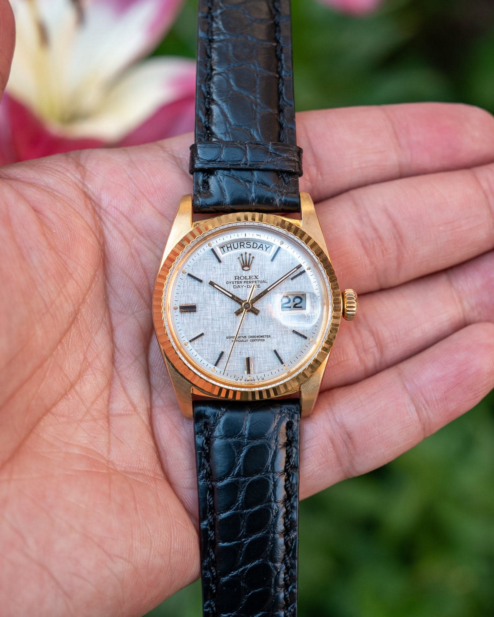 May be an image of wrist watch and text