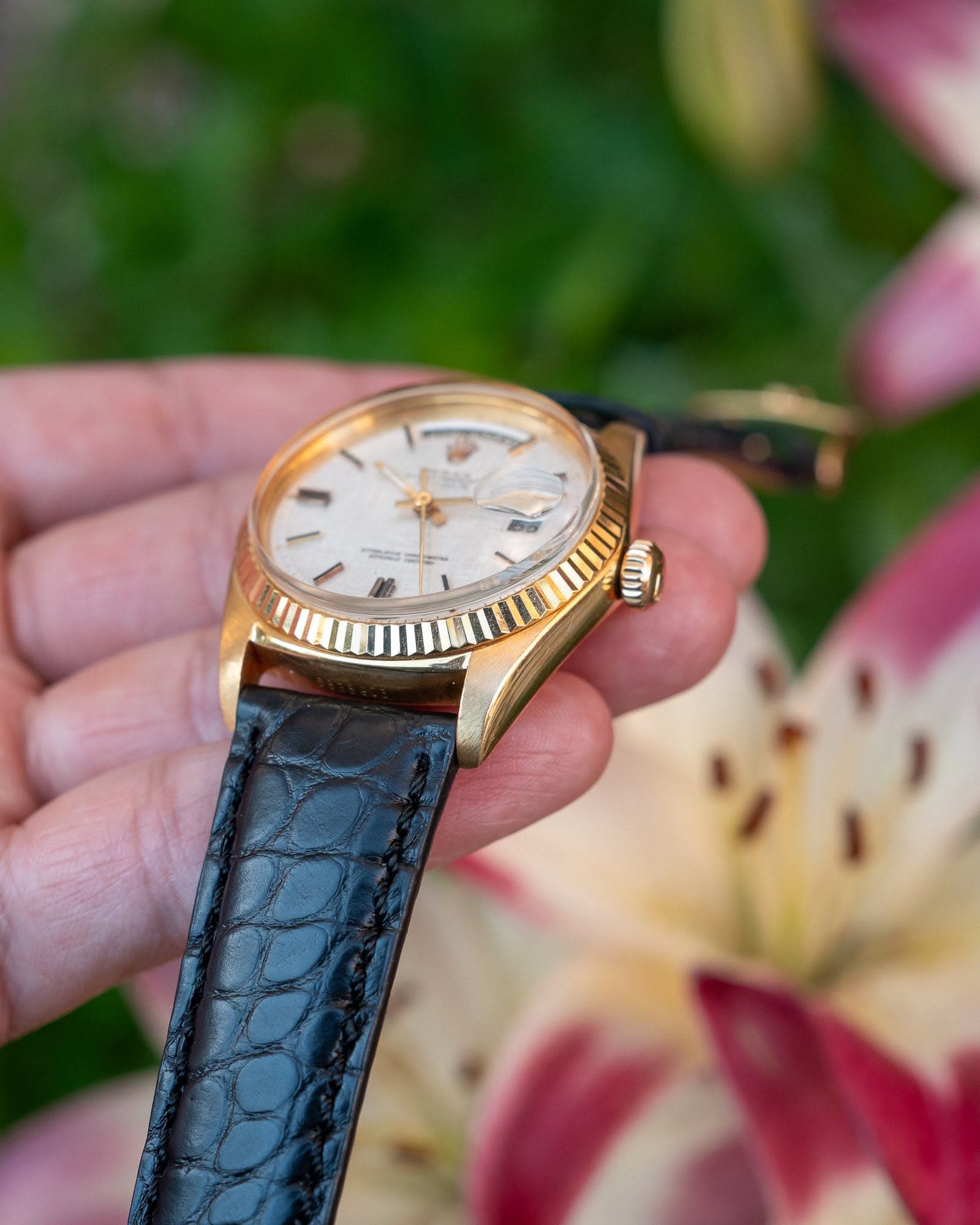 May be an image of wrist watch and text
