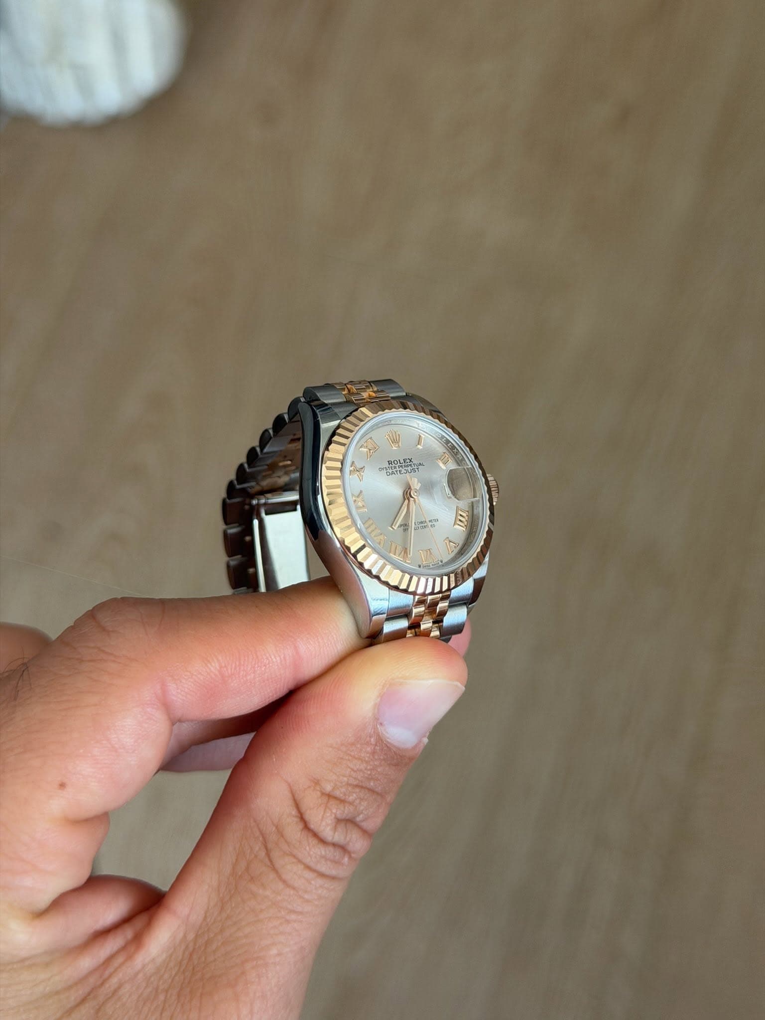 May be an image of wrist watch and text
