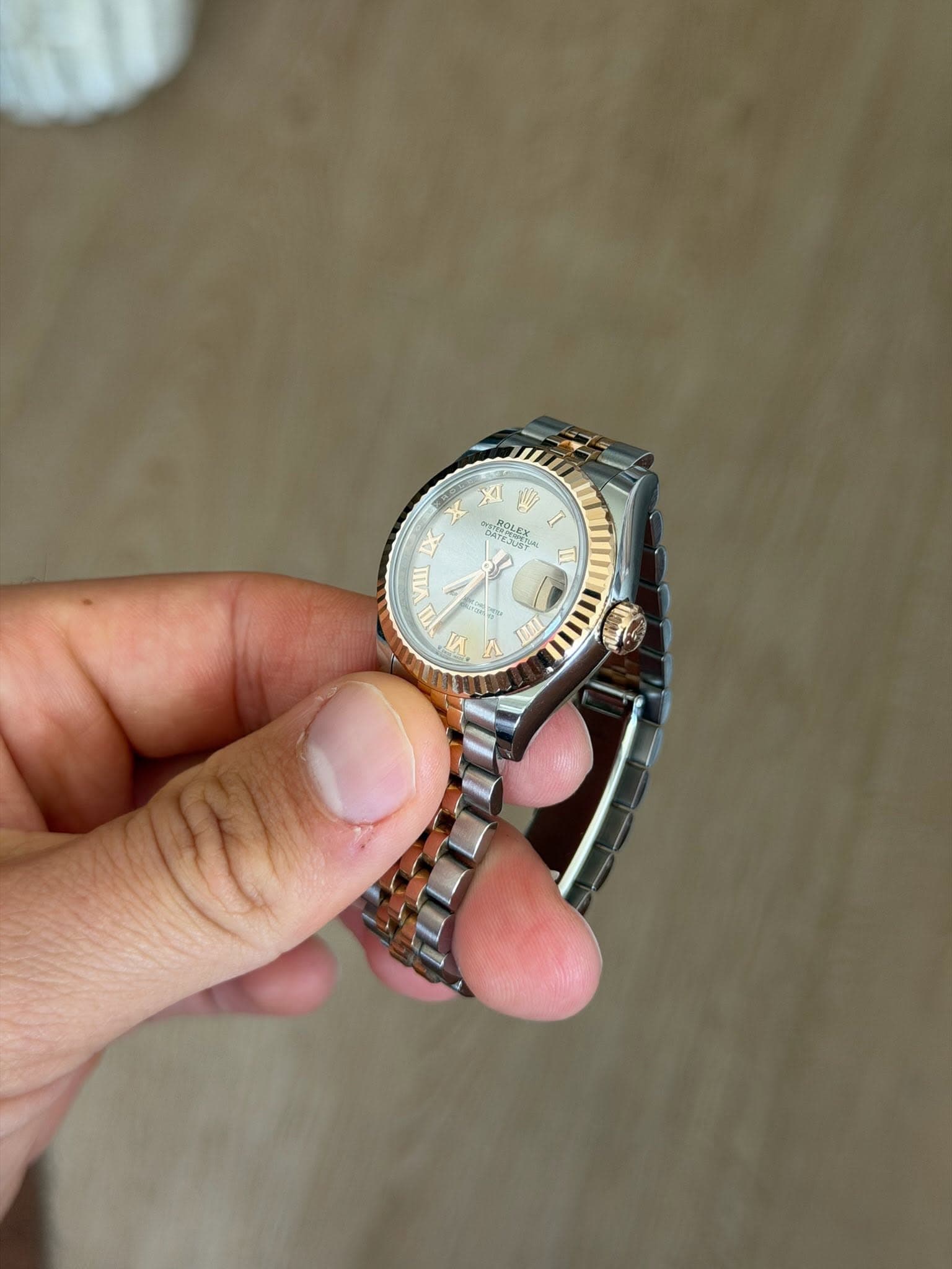 May be an image of wrist watch and text