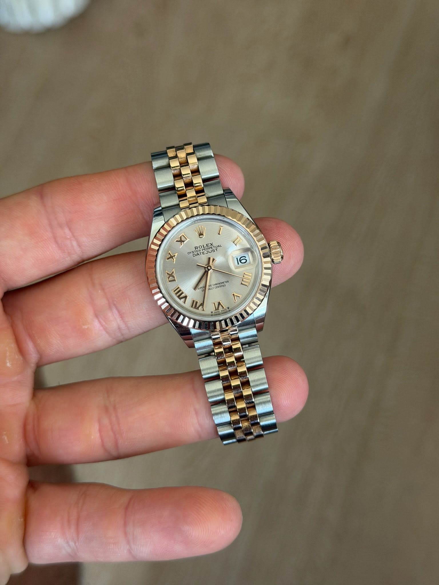 May be an image of wrist watch and text