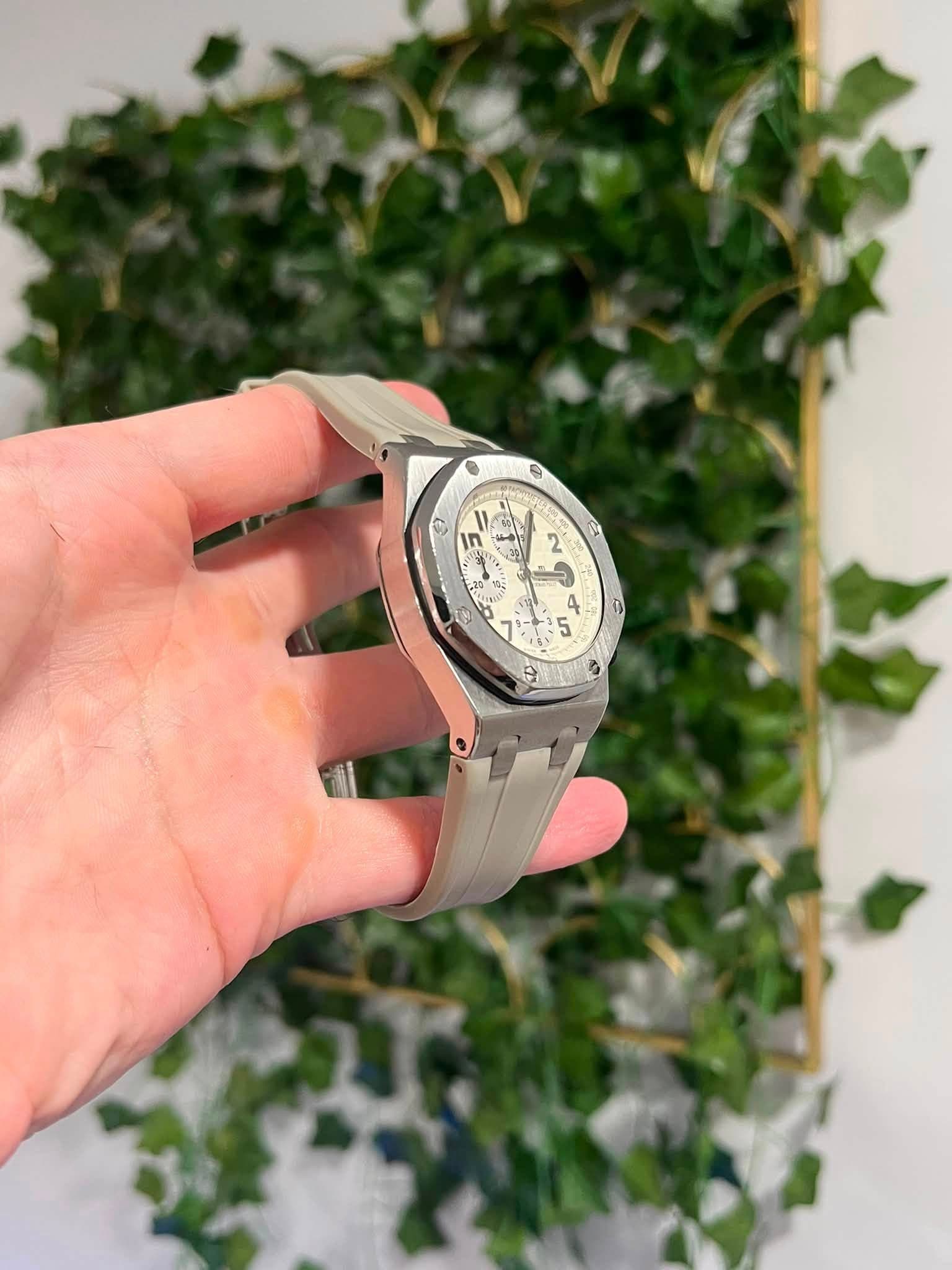 May be an image of wrist watch and text