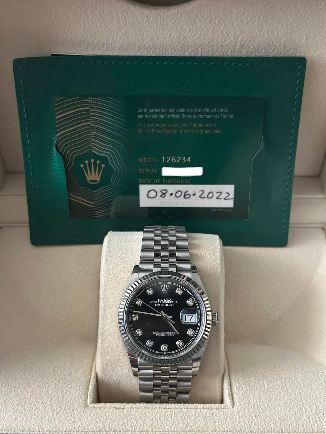 May be an image of wrist watch and text