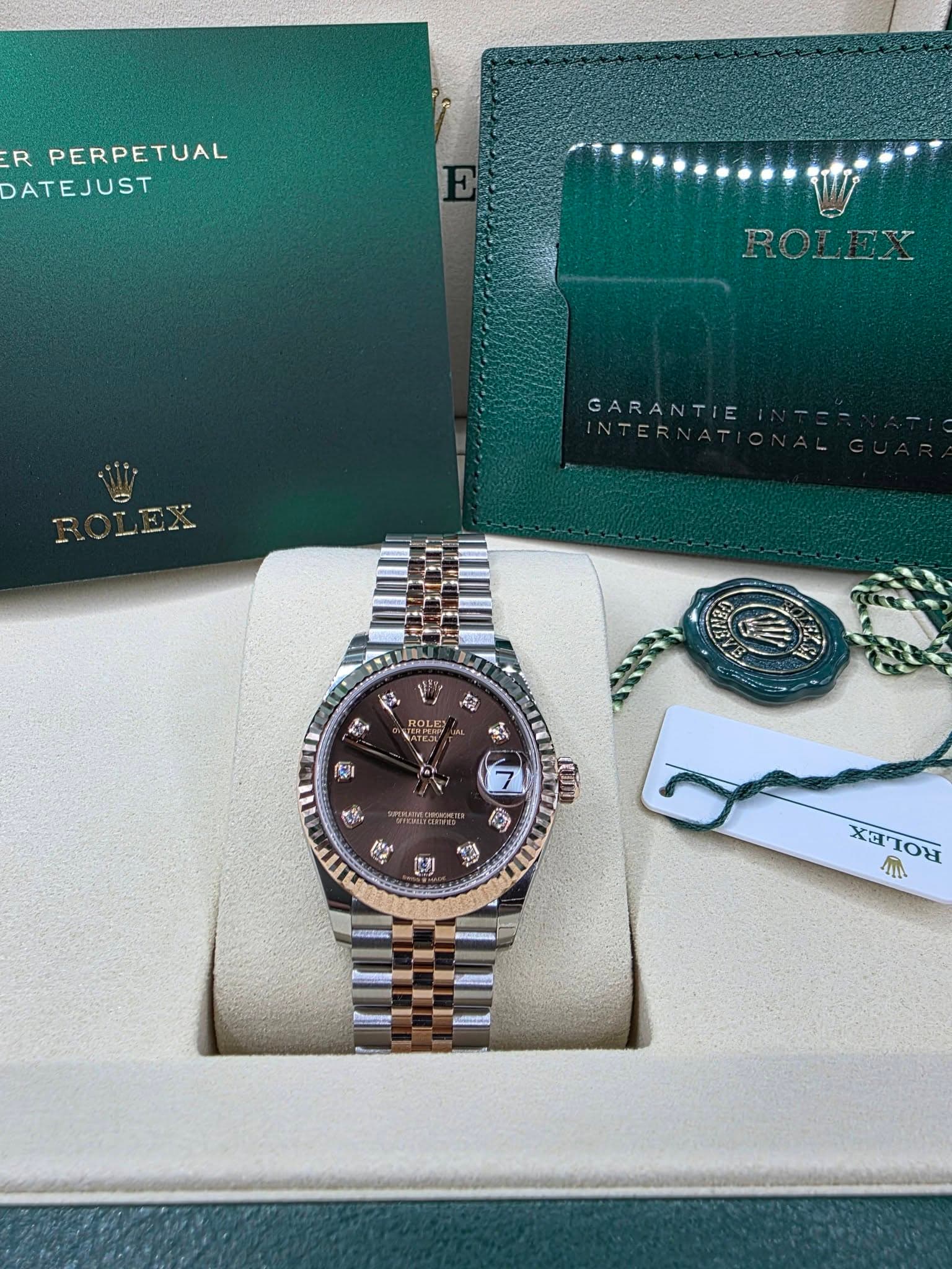 May be an image of wrist watch and text that says 'R PERPETUAL DATEJUST ROLEY ጣ U- l GARANTIE NTERNATI ต ROLE MATFaL r 추한 انش O XαΊΟε XI A'