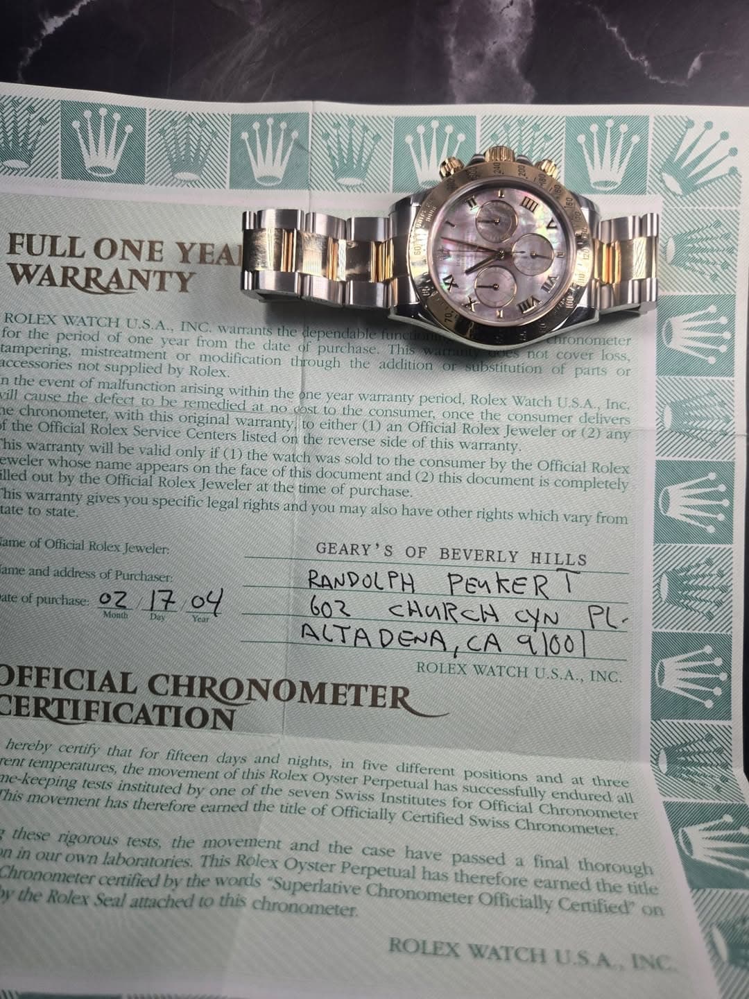 May be an image of ticket stub, wrist watch and text