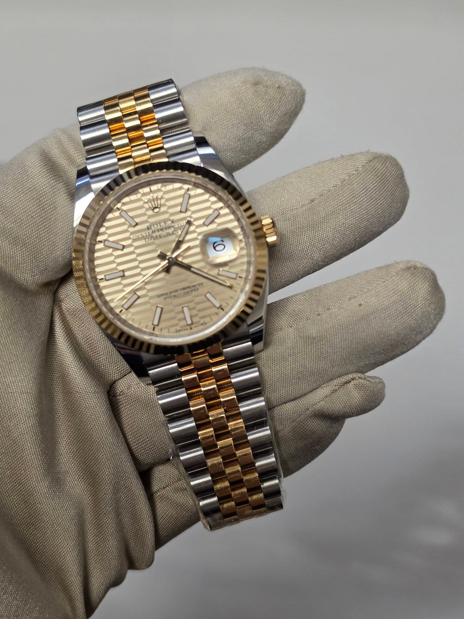 May be an image of wrist watch and text