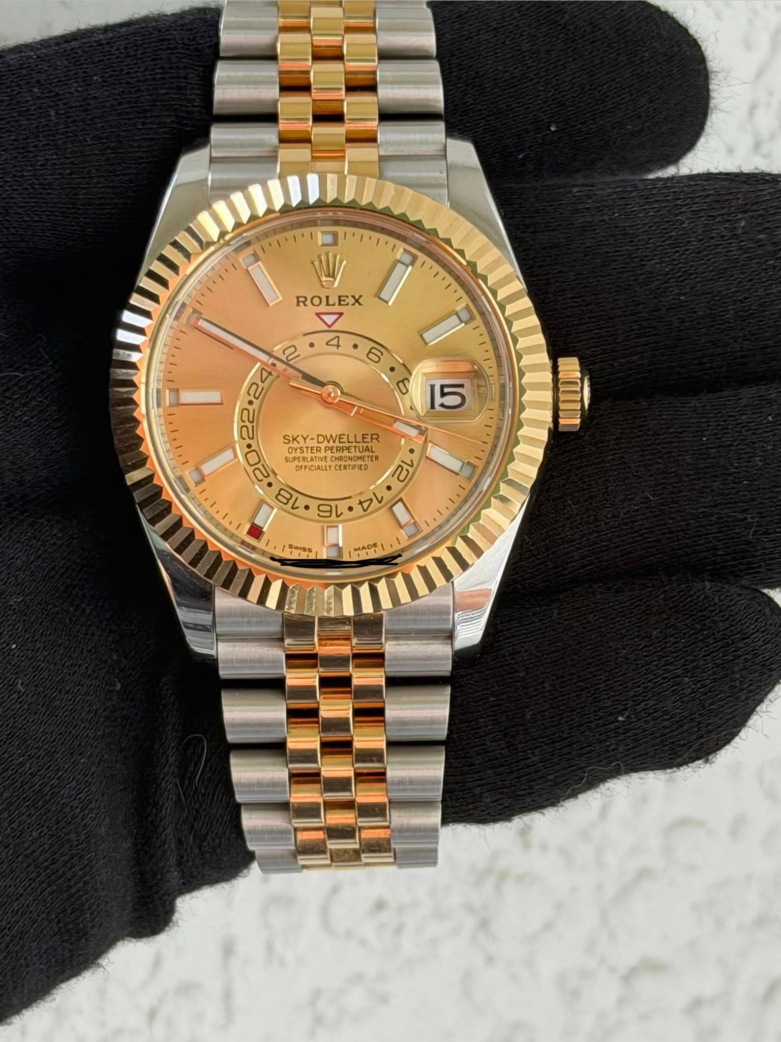 May be an image of wrist watch and text