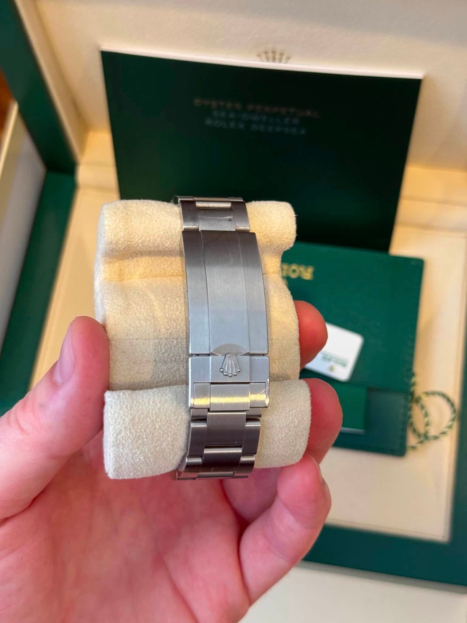 May be an image of wrist watch and text
