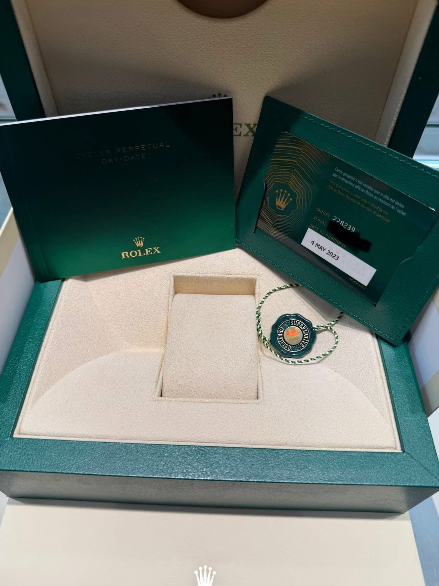 May be an image of wrist watch, ring and text that says 'ROLEX EX ROL MAY 2023'